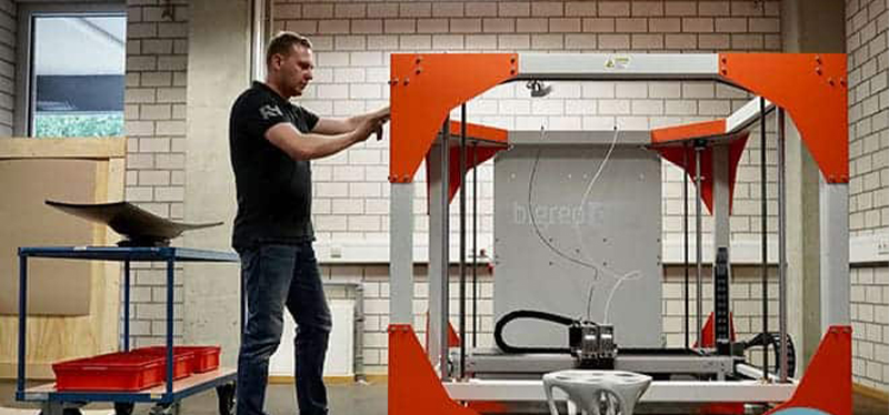 Technician operating a BigRep large-format 3D printer, showcasing advanced additive manufacturing for industrial-scale production.