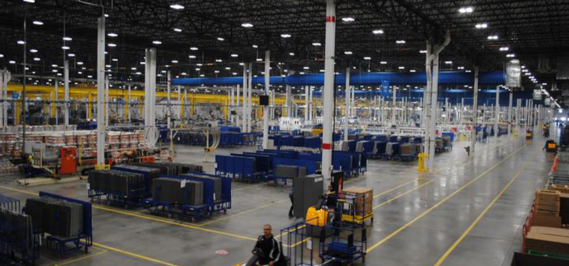 Daikin factory floor showcasing advanced manufacturing equipment and large-scale production lines in a spacious, organized industrial environment.