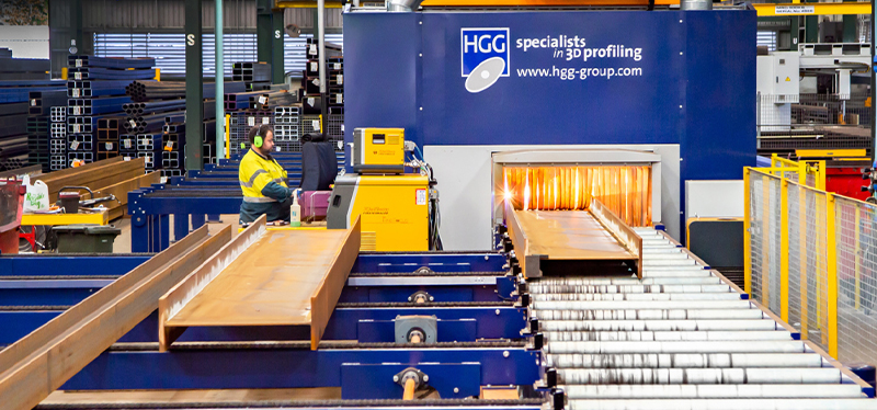 HGG Group 3D profiling machine in operation, showcasing advanced precision cutting for beams and steel structures in an industrial setting.